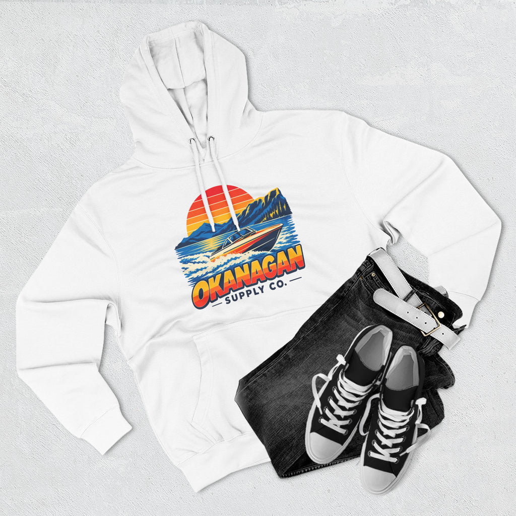 Okanagan Supply Co. Lake Day Speedboat Hoodie in white, flat lay with jeans and sneakers