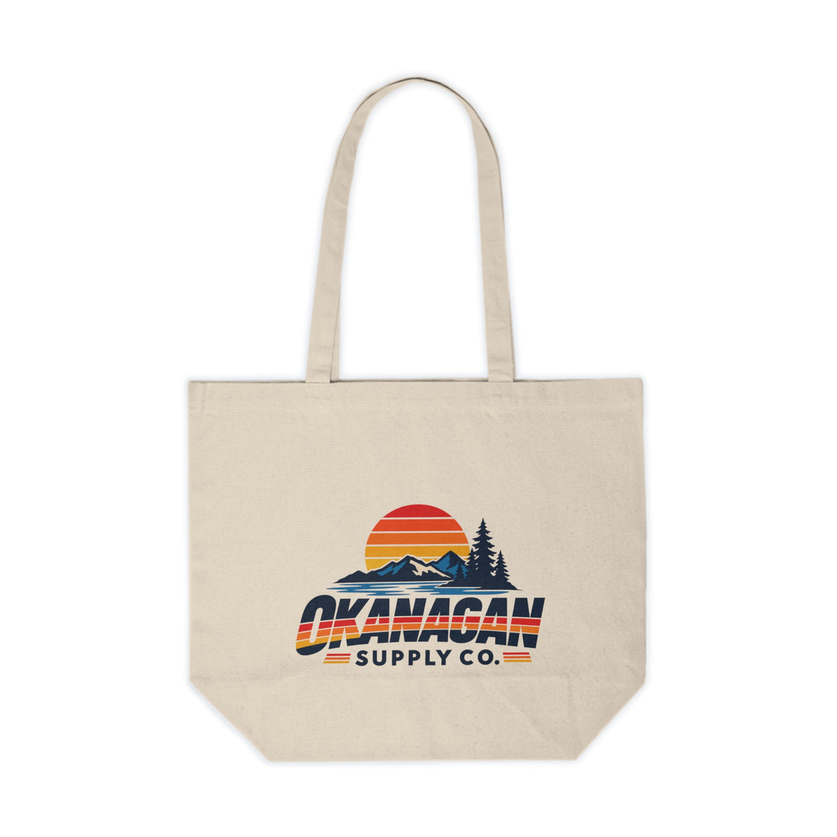 Okanagan Supply Co. Vintage Outdoors Canvas Tote in natural, front view with the retro mountain and sunset print