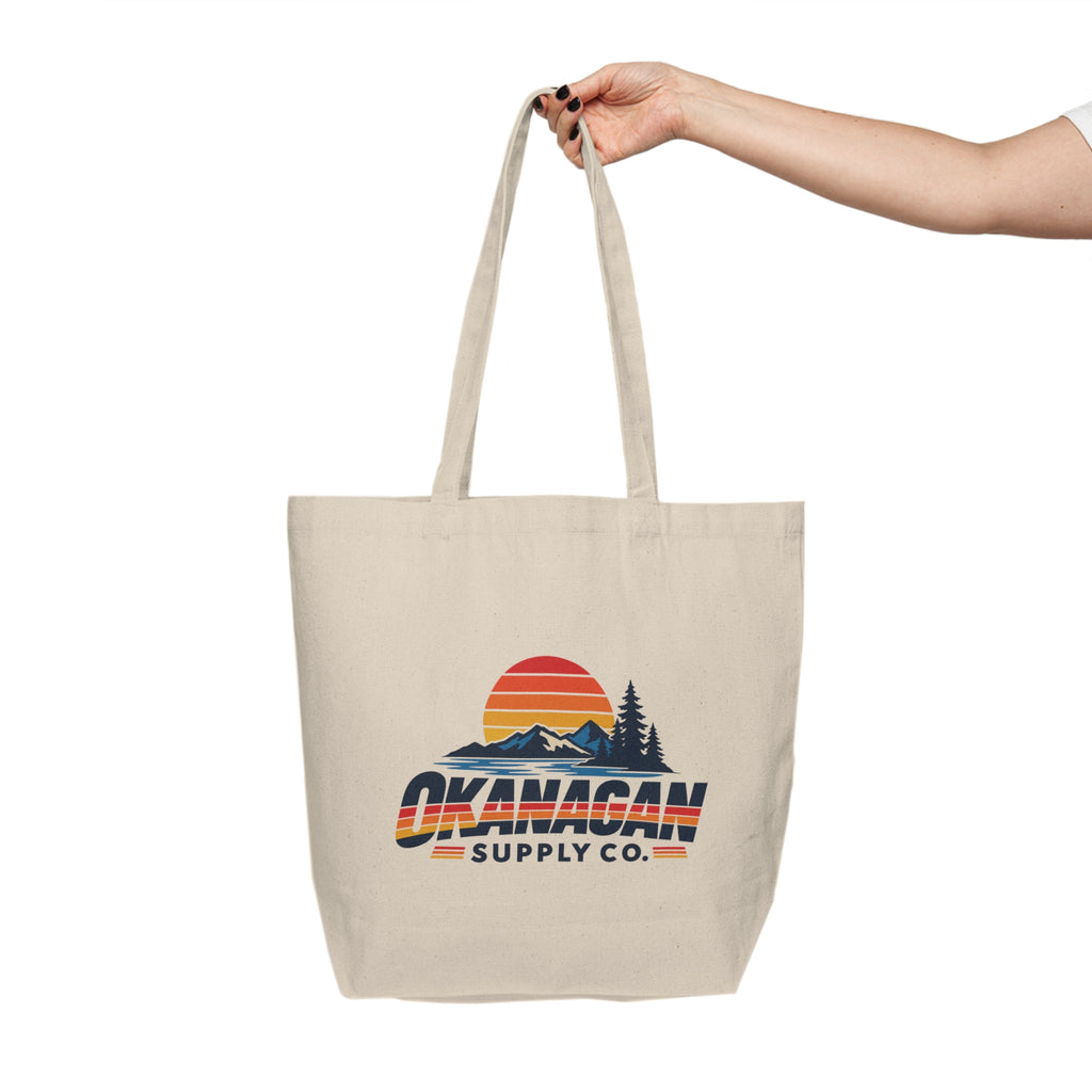 Okanagan Supply Co. Vintage Outdoors Canvas Tote carried by the shoulder strap