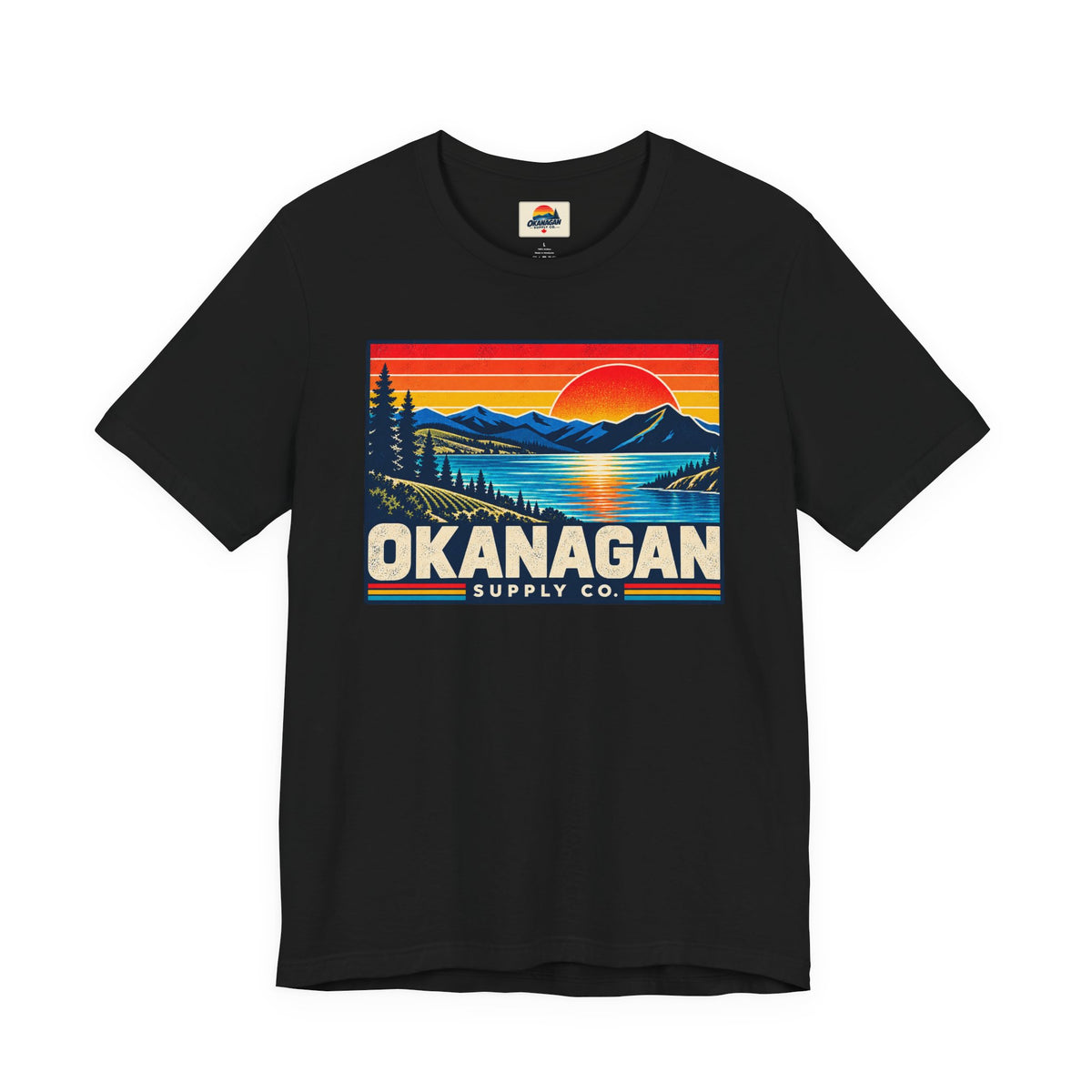 Okanagan Supply Co. Retro Sunset Tee in black, front view with retro Okanagan lake sunset badge
