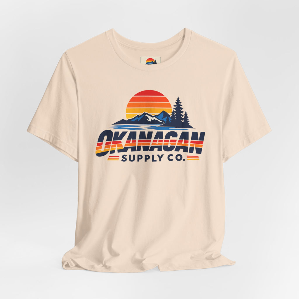 Okanagan Supply Co. Vintage Outdoors Tee in soft cream, styled flat view