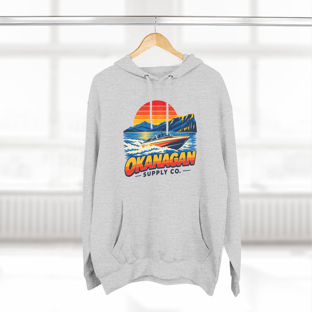 Okanagan Supply Co. Lake Day Speedboat Hoodie in heather grey, hanging on a rack