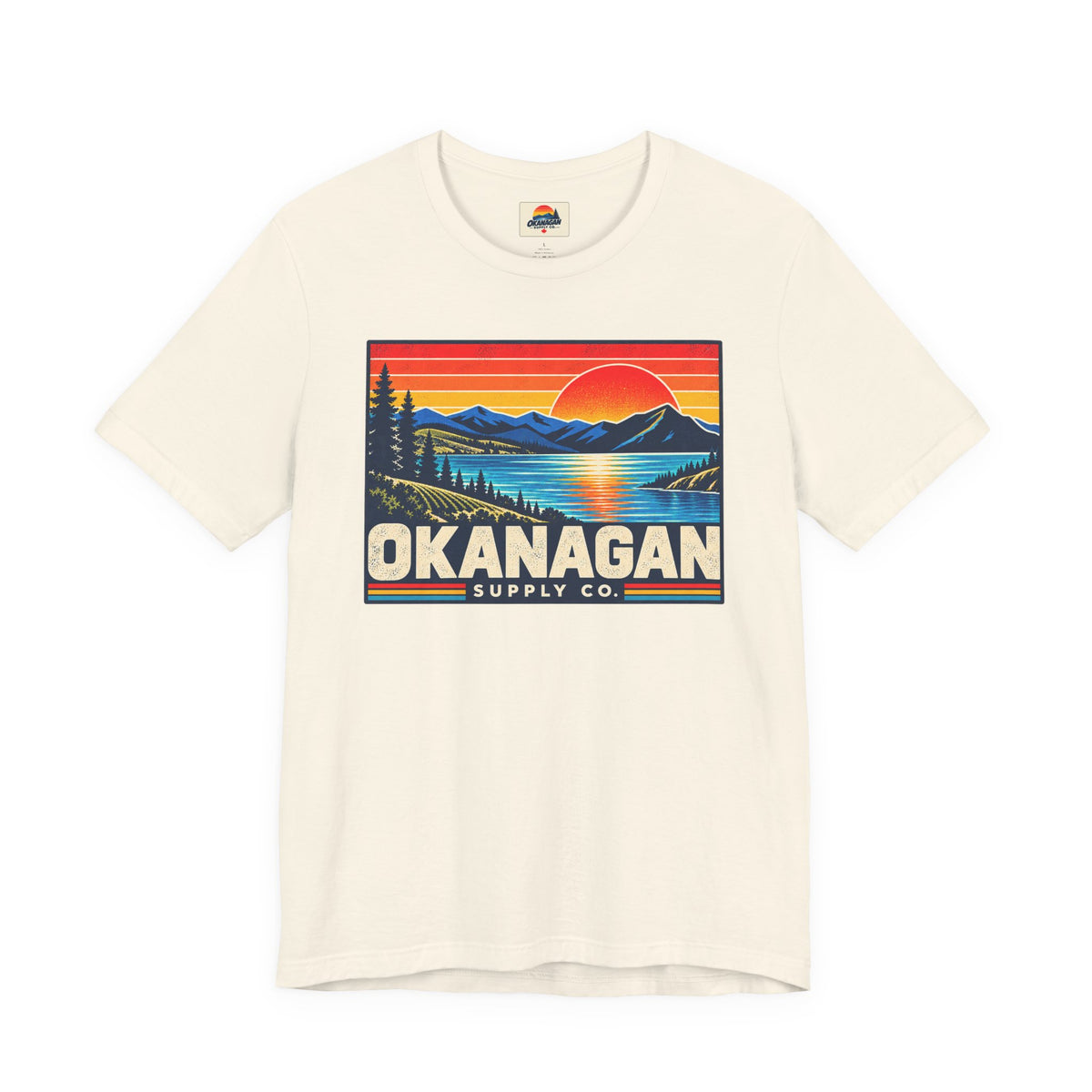 Okanagan Supply Co. Retro Sunset Tee in natural, front view with retro Okanagan lake sunset badge