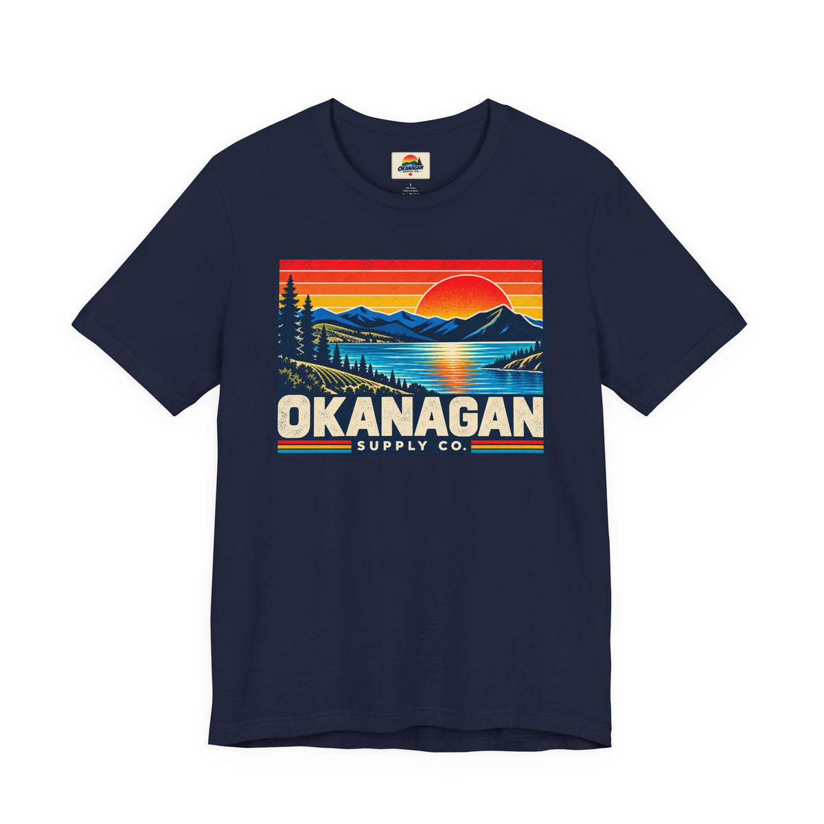 Okanagan Supply Co. Retro Sunset Tee in navy, front view with retro Okanagan lake sunset badge