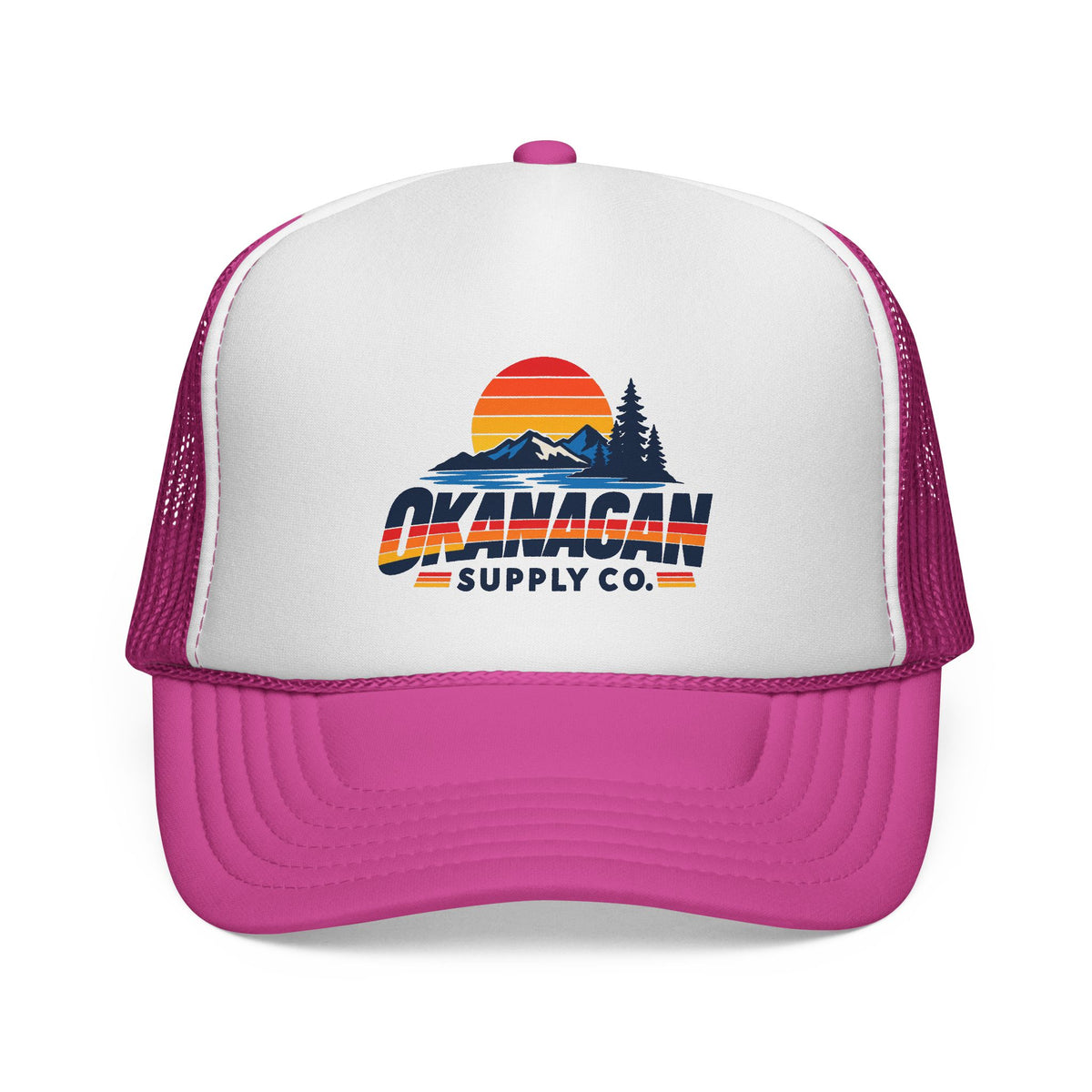 Okanagan Supply Co. Vintage Outdoors trucker hat in pink, front view with retro sunset, mountain and pine logo