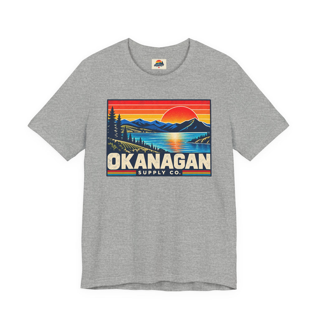 Okanagan Supply Co. Retro Sunset Tee in athletic heather, front view with retro Okanagan lake sunset badge