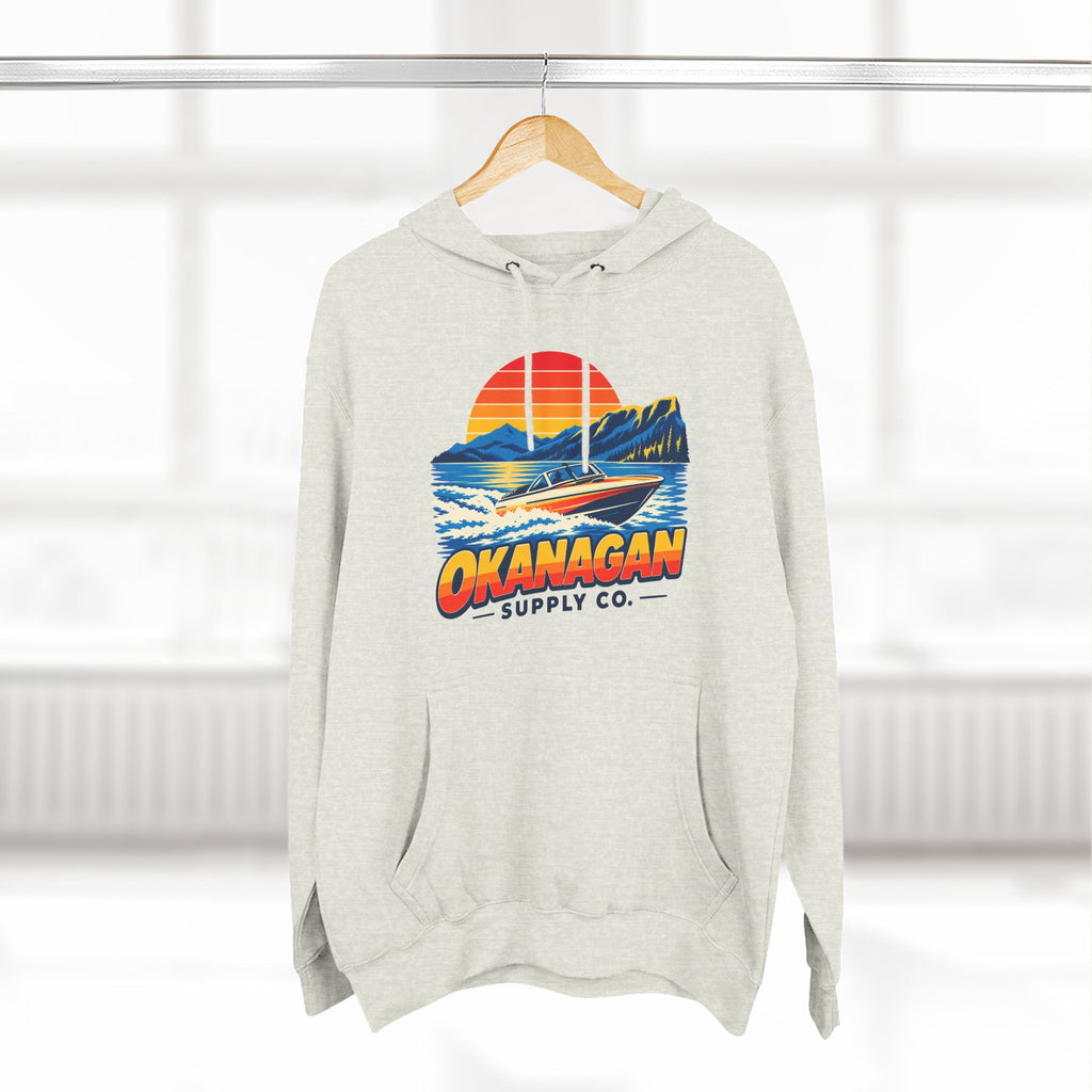 Okanagan Supply Co. Lake Day Speedboat Hoodie in oatmeal heather, hanging on a rack