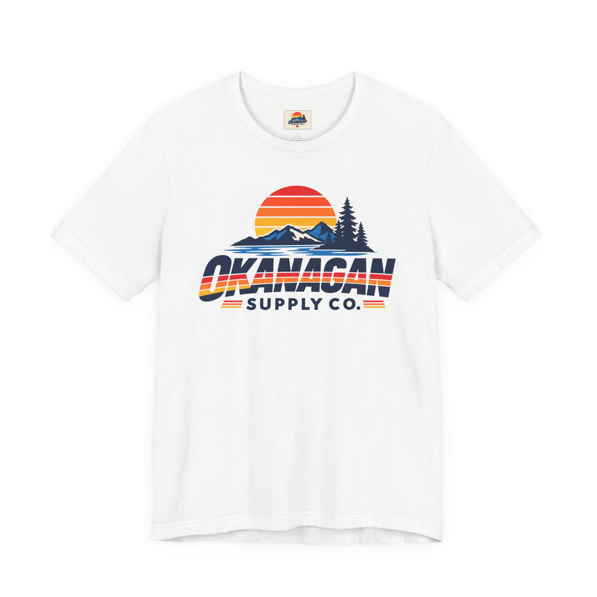 Okanagan Supply Co. Vintage Outdoors Tee in white, front view with retro sunset, mountain and pine print