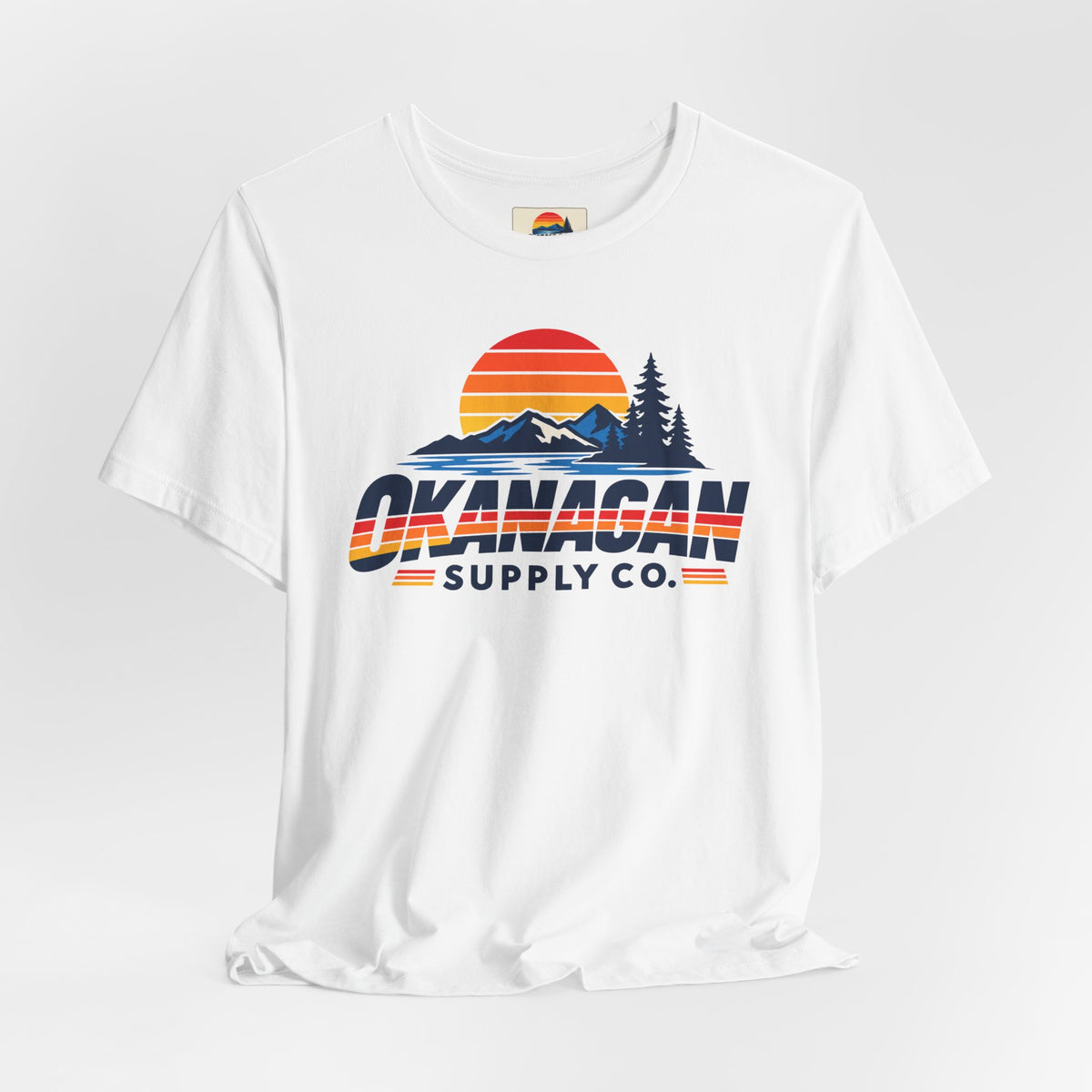 Okanagan Supply Co. Vintage Outdoors Tee in white, styled flat view